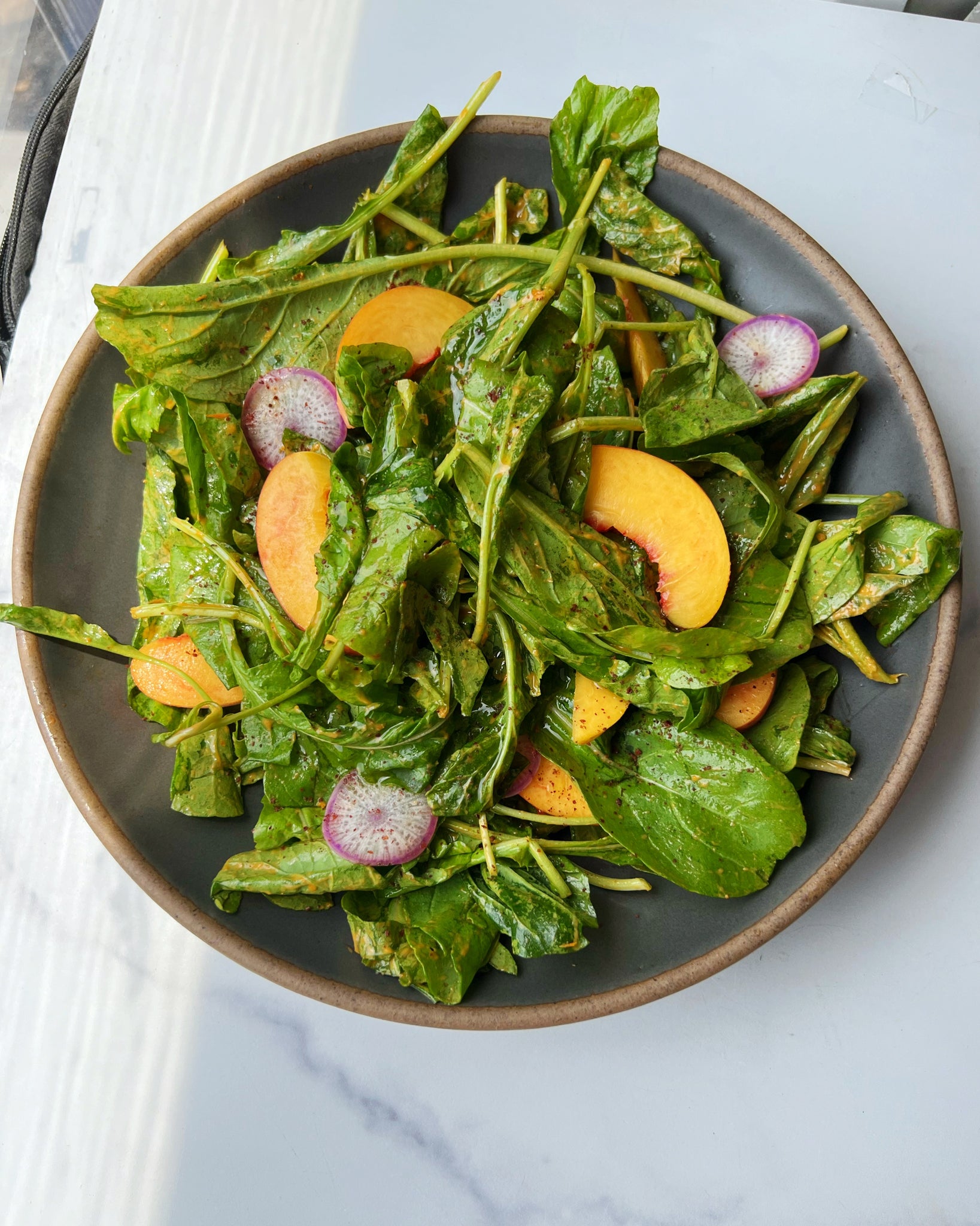 Arugula with Peach Sumac Vinaigrette