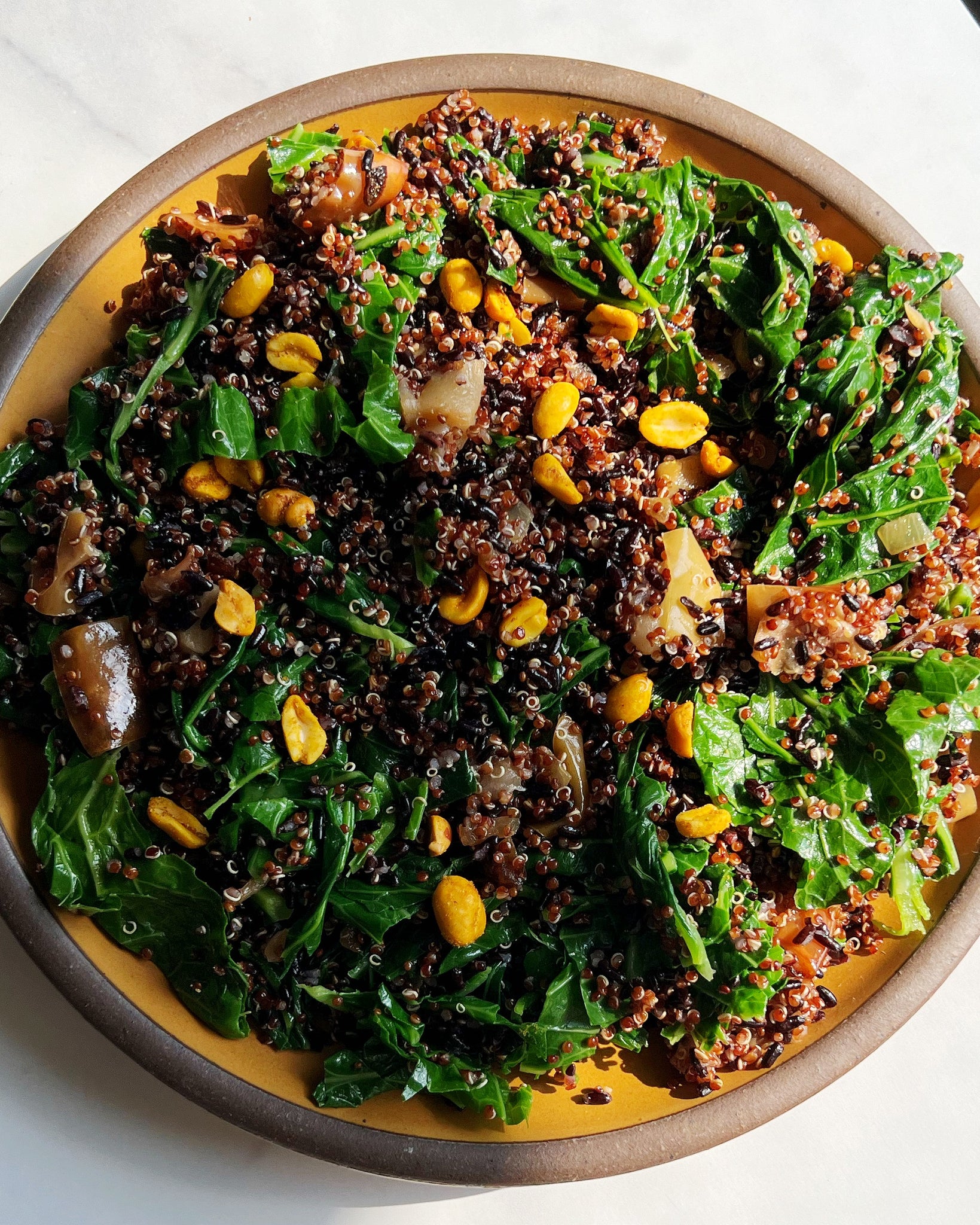 Quinoa And Collard Salad With Sweet Turmeric Peanuts And Roasted Apples